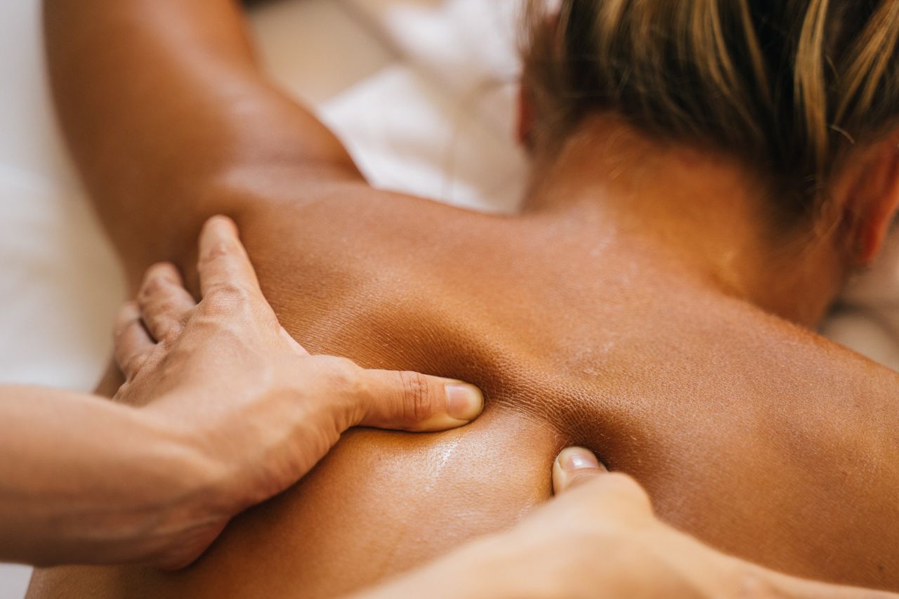 Close-up of a soothing back massage, promoting relaxation and wellness.